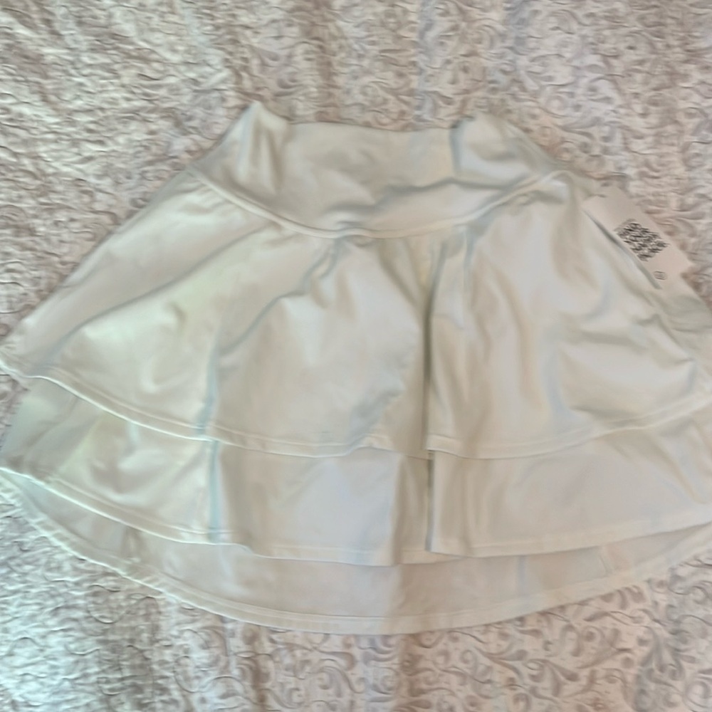 White/cream built-in shorts workout skirt from Gilly Hicks extra small